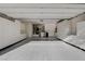 Spacious garage featuring epoxy flooring, ample cabinet storage space, and modern lighting at 1904 Hot Oak Ridge St, Las Vegas, NV 89134