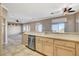 Kitchen features light cabinets, stainless steel appliances and is open to the living area for easy entertaining at 1904 Hot Oak Ridge St, Las Vegas, NV 89134