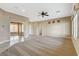 Open-concept living area with tile flooring, neutral walls, a ceiling fan, and recessed lighting at 1904 Hot Oak Ridge St, Las Vegas, NV 89134