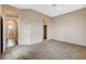 Spacious main bedroom with neutral colors, ceiling fan, and a view of the en-suite bathroom and walk-in closet at 1904 Hot Oak Ridge St, Las Vegas, NV 89134