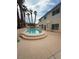 Home backyard features a private pool surrounded by palm trees and desert landscaping at 1941 Golden Trumpet Ave, Las Vegas, NV 89123