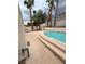 Backyard boasts a private pool and patio area surrounded by lush greenery for outdoor enjoyment at 1941 Golden Trumpet Ave, Las Vegas, NV 89123