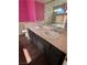 Bathroom with double sinks, granite countertops, and glass-enclosed shower at 1941 Golden Trumpet Ave, Las Vegas, NV 89123