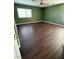 Spacious bedroom with modern ceiling fan and new laminate flooring at 1941 Golden Trumpet Ave, Las Vegas, NV 89123