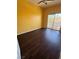 Bedroom with laminate flooring and sliding glass door leading to balcony at 1941 Golden Trumpet Ave, Las Vegas, NV 89123