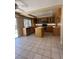 Charming kitchen with island, stainless steel appliances, and tile flooring at 1941 Golden Trumpet Ave, Las Vegas, NV 89123