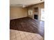Open-concept living room featuring a fireplace and access to the backyard at 1941 Golden Trumpet Ave, Las Vegas, NV 89123