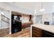 Kitchen boasts modern appliances, sleek cabinets, and an island for meal prep and entertaining, with access to the stairs at 209 Camino Vista St, Henderson, NV 89012