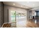 Living room with fireplace and sliding glass doors that open to a backyard pool at 209 Camino Vista St, Henderson, NV 89012