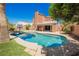Inviting backyard pool with a basketball hoop for fun and mature landscaping at 209 Camino Vista St, Henderson, NV 89012