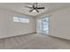 Spacious bedroom with neutral carpet and a large sliding glass door and small window to allow plenty of light at 2124 Willowbury Dr # D, Las Vegas, NV 89108