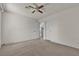 View of a carpeted bedroom showing two entry doors and ample space at 2124 Willowbury Dr # D, Las Vegas, NV 89108