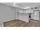 Kitchen with white cabinets, laminate countertops, and modern appliances at 2124 Willowbury Dr # D, Las Vegas, NV 89108