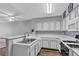 Bright kitchen featuring white cabinets, laminate countertops, and modern appliances at 2124 Willowbury Dr # D, Las Vegas, NV 89108
