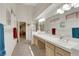 Neutral bathroom with dual sinks, a large mirror, and ample counter space with natural lighting at 2216 Sapphire Valley St, Las Vegas, NV 89128