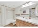 Clean and functional bathroom with a shower-tub combo, vanity, and ample lighting, offering a relaxing space at 2216 Sapphire Valley St, Las Vegas, NV 89128