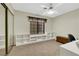 Bright bedroom with built-in shelves, window seating, and neutral carpet, perfect for a home office at 2216 Sapphire Valley St, Las Vegas, NV 89128