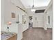 Bright entryway with high ceilings, tile flooring, and built-in display shelving, leading to the rest of the home at 2216 Sapphire Valley St, Las Vegas, NV 89128
