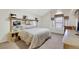 Serene primary bedroom featuring a mirrored headboard, a vaulted ceiling, and a corner window at 2216 Sapphire Valley St, Las Vegas, NV 89128
