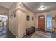 Stylish foyer featuring tiled floors, front door and views to kitchen and living areas at 2231 Marlboro Dr, Henderson, NV 89014