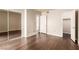 Large bedroom with a mirrored closet and wood floors at 2606 Durango Dr # 181, Las Vegas, NV 89117