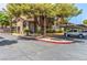 Charming condo complex with desert landscaping, covered parking, and mature trees at 2606 Durango Dr # 181, Las Vegas, NV 89117