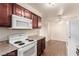 Kitchen featuring matching appliances and a dining area with a ceiling fan at 2606 Durango Dr # 181, Las Vegas, NV 89117