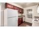 Well-lit kitchen featuring wood floors, and matching appliances at 2606 Durango Dr # 181, Las Vegas, NV 89117