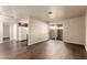 Well-lit living room with hardwood floors and sliding door access to the patio at 2606 Durango Dr # 181, Las Vegas, NV 89117