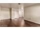 Open-concept living room with hardwood floors and ceiling fan at 2606 Durango Dr # 181, Las Vegas, NV 89117
