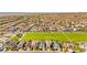 An aerial view showcasing the beautiful community surrounded by numerous houses and greenery at 3058 Casarano Ct, Henderson, NV 89044