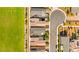 An aerial shot showcases the neat row of houses and lush green space of the neighborhood at 3058 Casarano Ct, Henderson, NV 89044
