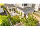 Beautiful home showcasing a landscaped backyard with artificial turf and convenient access to the two-car garage at 3058 Casarano Ct, Henderson, NV 89044