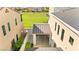 Backyard aerial view with outdoor patio, stylish lighting, and meticulous, low-maintenance landscaping at 3058 Casarano Ct, Henderson, NV 89044