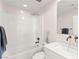 Bathroom with a shower over tub, modern fixtures, and a sleek vanity at 3058 Casarano Ct, Henderson, NV 89044
