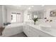 Bright bathroom features double sinks, soaking tub, step-in shower, and ample natural light at 3058 Casarano Ct, Henderson, NV 89044