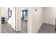 Hallway leads to a bedroom or playroom with a unique accent wall in cool, modern tones at 3058 Casarano Ct, Henderson, NV 89044