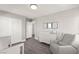 Cozy Bedroom featuring a gray rocker and white dresser, creating a calming space at 3058 Casarano Ct, Henderson, NV 89044