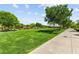 Expansive community park featuring lush green grass, mature trees, and shaded picnic areas for outdoor enjoyment at 3058 Casarano Ct, Henderson, NV 89044