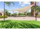 Outdoor covered community space with manicured landscaping, decorative lighting and seating for neighborhood events at 3058 Casarano Ct, Henderson, NV 89044