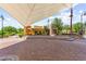 Outdoor covered community space with manicured landscaping and stone work in an inviting location at 3058 Casarano Ct, Henderson, NV 89044