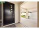 Modern entrance with dark door, leading to courtyard at 3058 Casarano Ct, Henderson, NV 89044