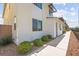 Side view of home with clean lines, modern design, and manicured landscaping at 3058 Casarano Ct, Henderson, NV 89044