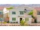 Modern two-story home with unique architectural design and well-maintained landscaping at 3058 Casarano Ct, Henderson, NV 89044