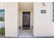 Inviting front entrance featuring a stylish door, decorative wreath, and modern address plaque at 3058 Casarano Ct, Henderson, NV 89044