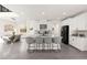 Open-concept kitchen with large island, modern appliances, and adjacent dining area at 3058 Casarano Ct, Henderson, NV 89044