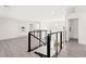 Spacious loft area with modern railings, offering a versatile space for relaxation or entertainment at 3058 Casarano Ct, Henderson, NV 89044