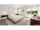 Serene main bedroom with large windows offering scenic views, and comfortable furnishings at 3058 Casarano Ct, Henderson, NV 89044