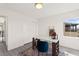 Comfortable home office with a modern desk, neighborhood views, and sliding closet doors at 3058 Casarano Ct, Henderson, NV 89044