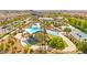 A vibrant playground with shade structures, slides, and lush landscaping, designed for enjoyment at 3058 Casarano Ct, Henderson, NV 89044